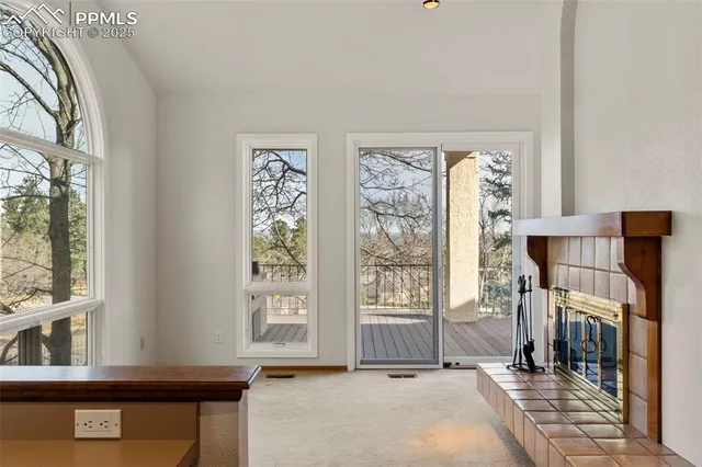 a view of a livingroom with a window and storage
