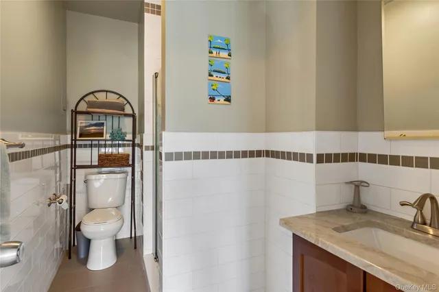 a view of a livingroom with furniture and a large window