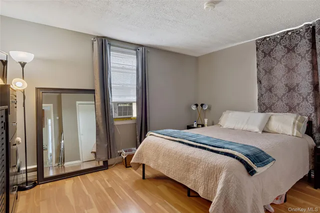 a bathroom with a granite countertop toilet and a sink