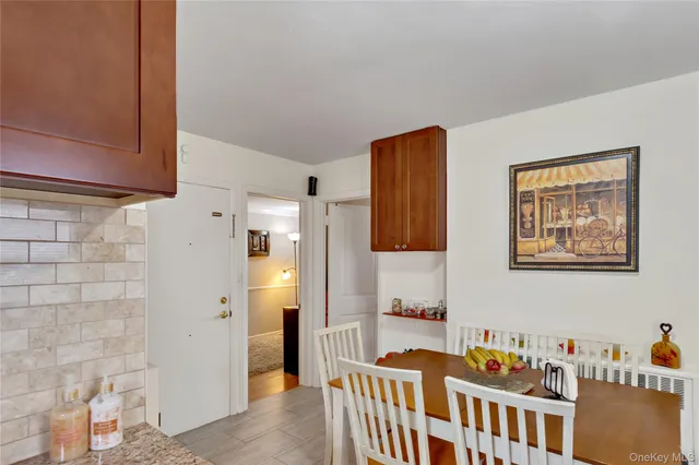 a kitchen with granite countertop stainless steel appliances stove microwave refrigerator and sink