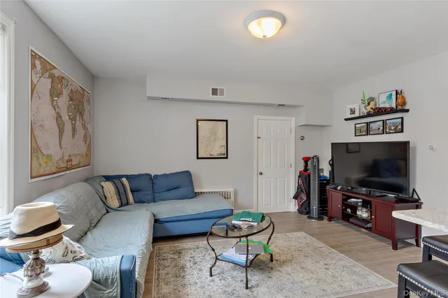 a kitchen with a table chairs and a refrigerator