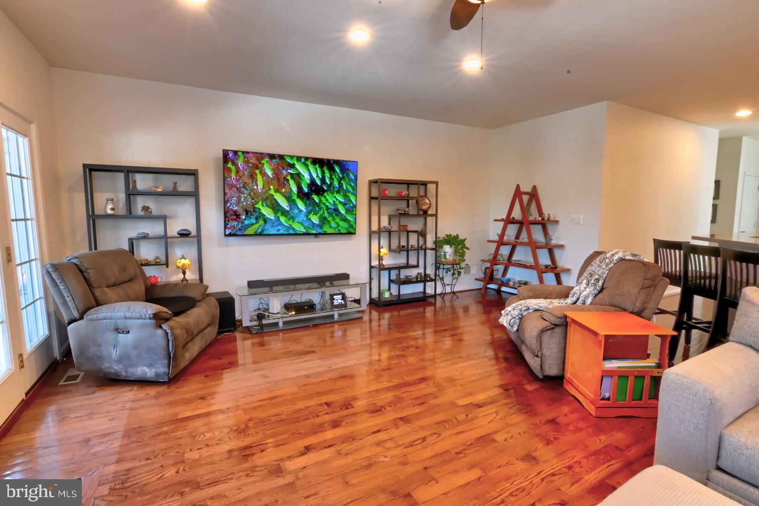 13170 Triple Crown Loop Gainesville, VA 20155 - Photo 29 of 71 a living room with furniture and a flat screen tv