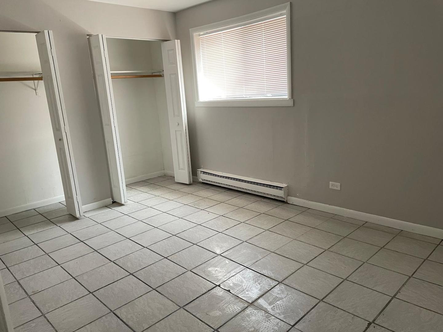 1751 Felten Road, Unit 1 Aurora, IL 60505 - Photo 11 of 19 an empty room with windows