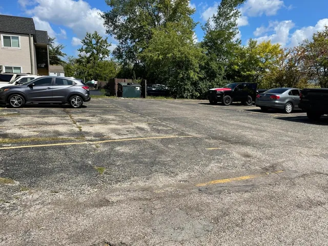 a view of street with parked cars