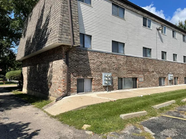 a view of a white house with a large windows