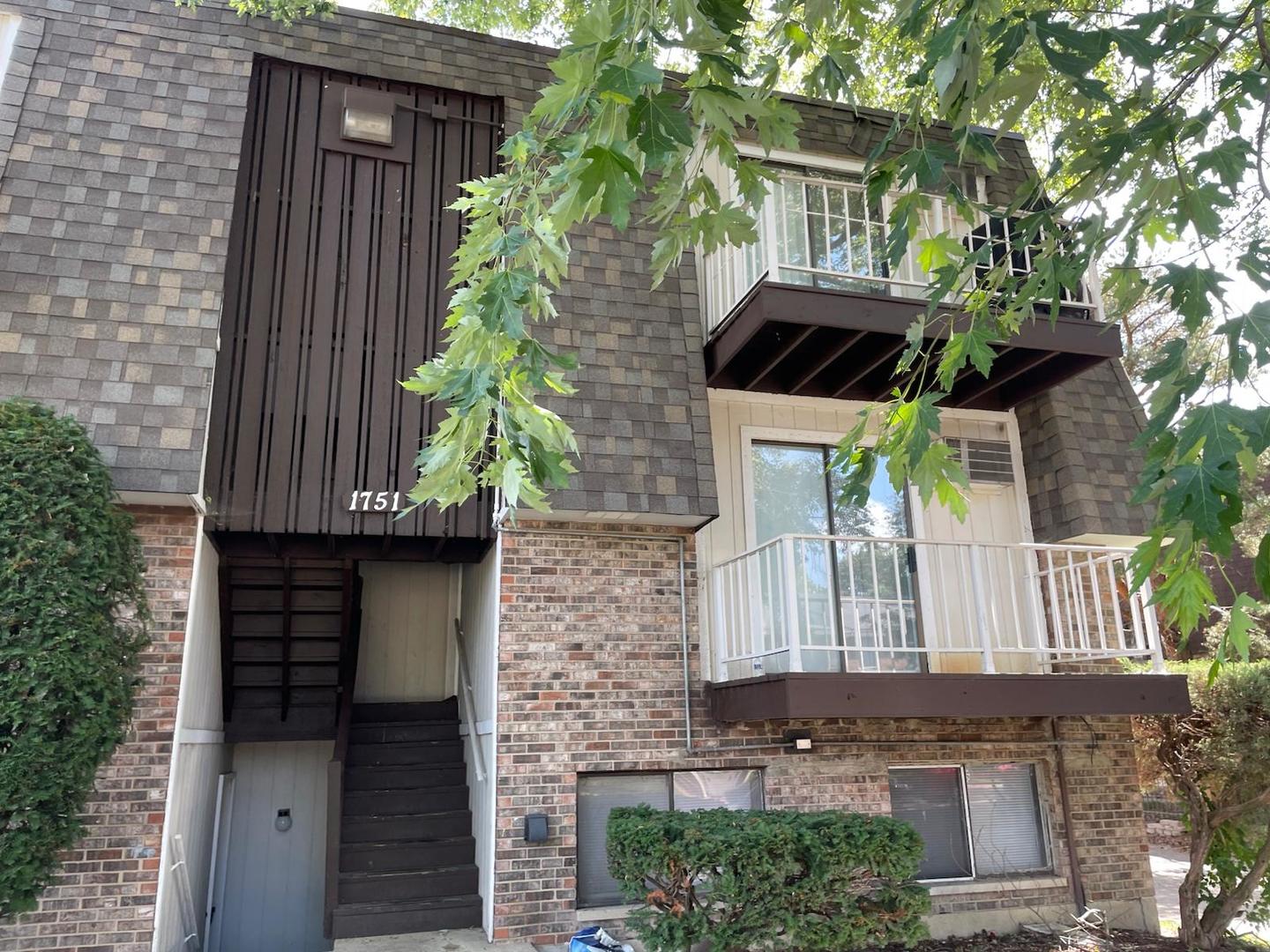 1751 Felten Road, Unit 1 Aurora, IL 60505 - Photo 2 of 19 a front view of a house with a garden
