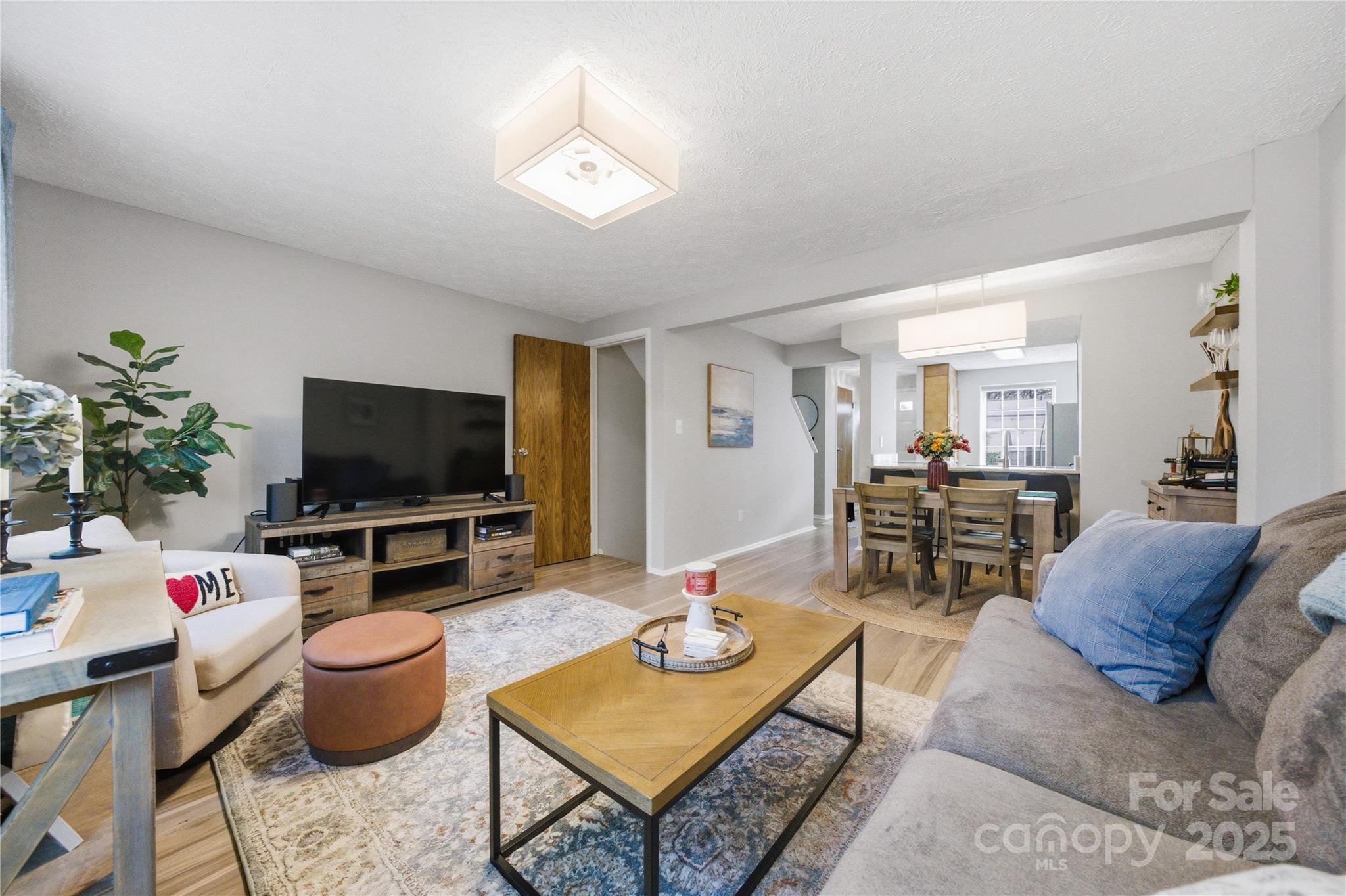 1235 Scaleybark Road, Unit C Charlotte, NC 28209 - Photo 12 of 33 a living room with furniture and a flat screen tv