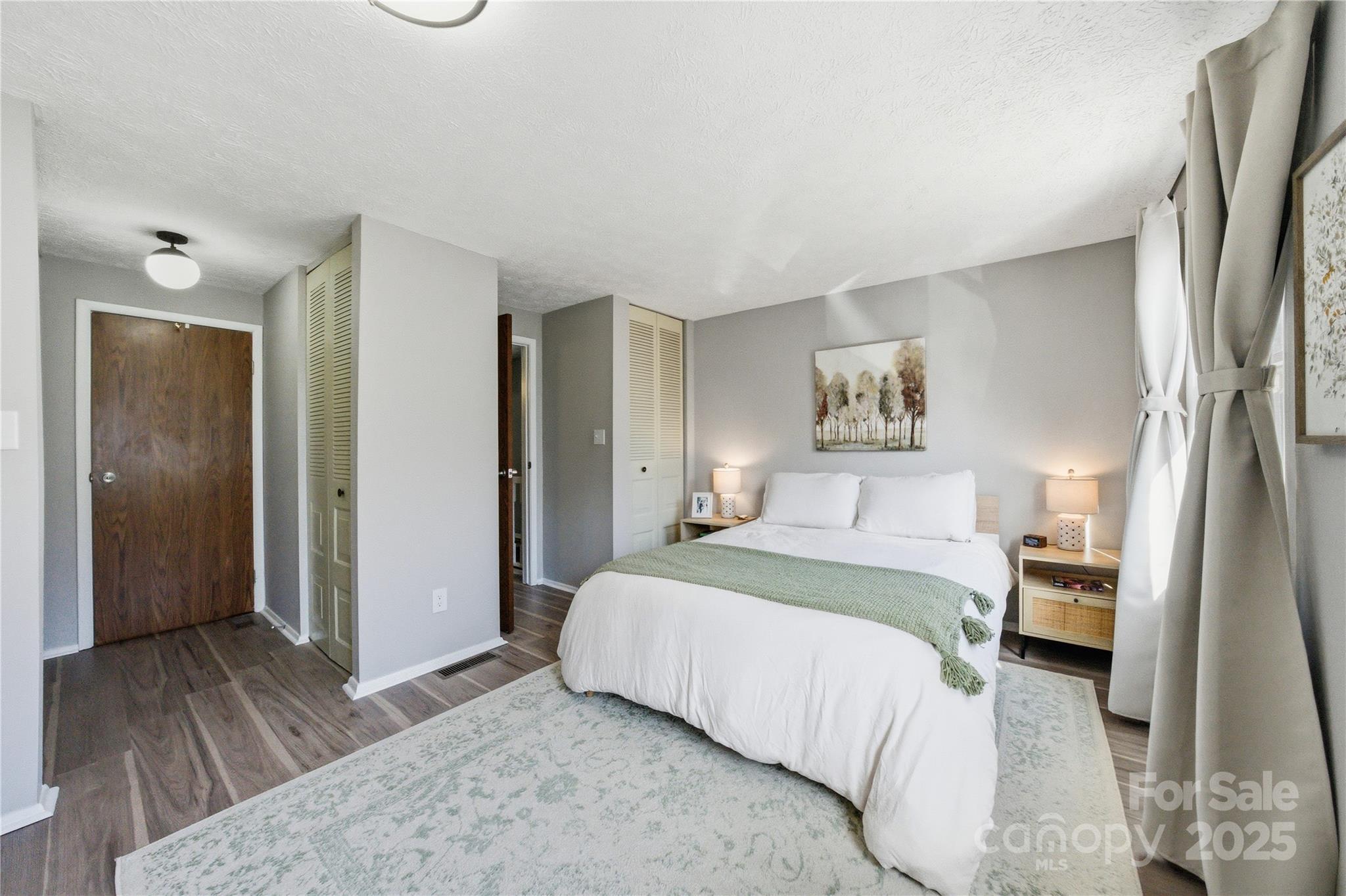 1235 Scaleybark Road, Unit C Charlotte, NC 28209 - Photo 17 of 33 a bedroom with a bed and a large mirror