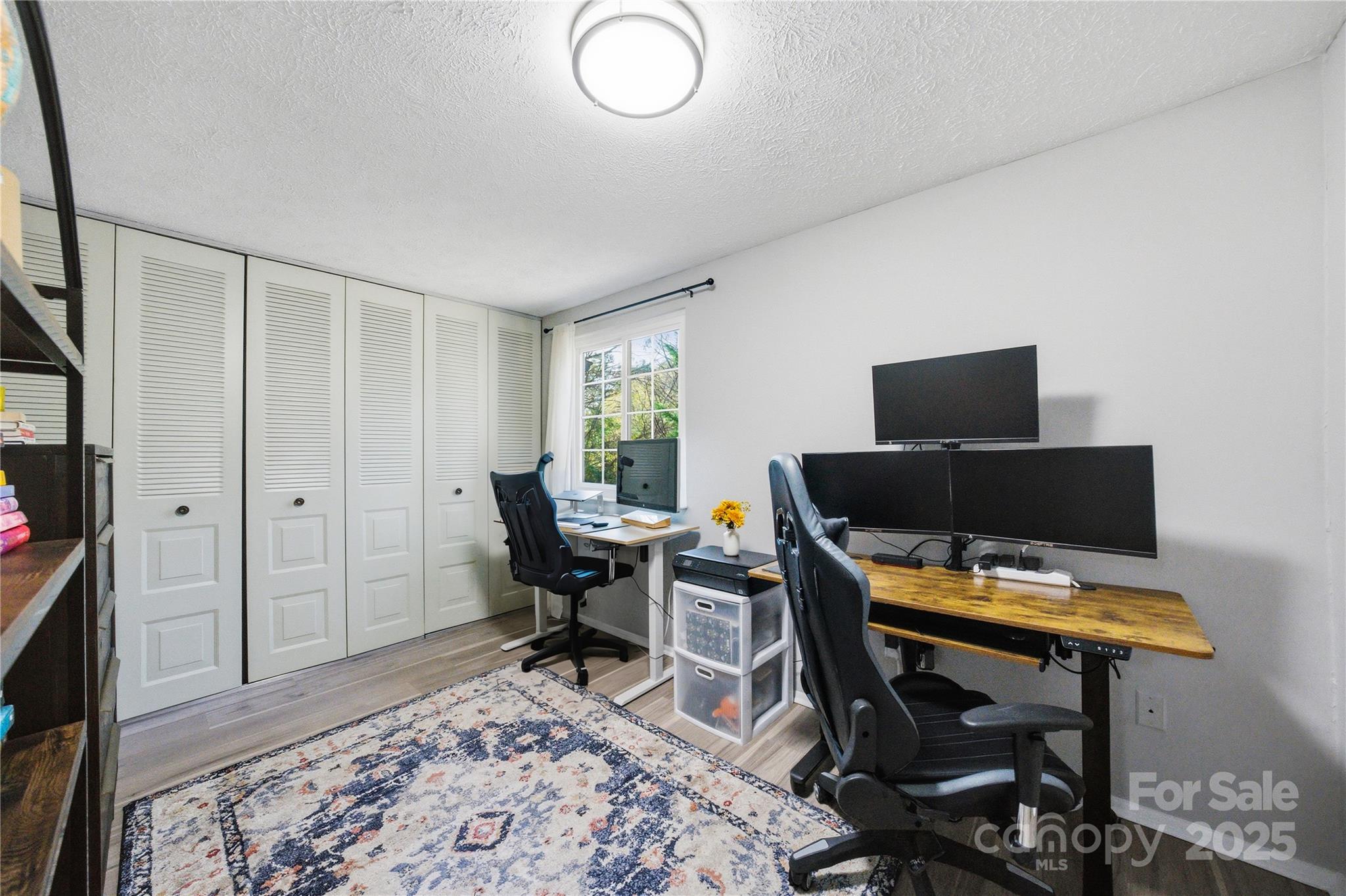 1235 Scaleybark Road, Unit C Charlotte, NC 28209 - Photo 19 of 33 a view of a workspace with furniture and a window