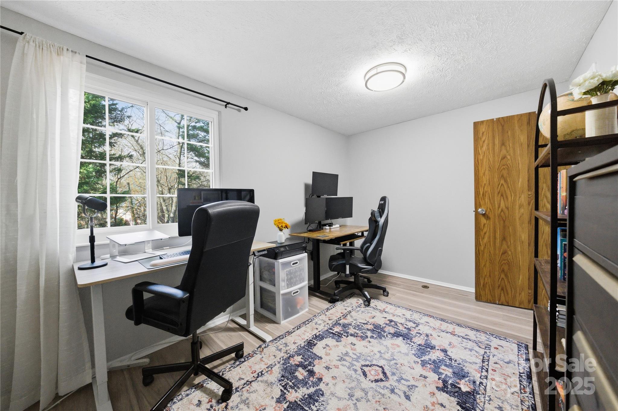 1235 Scaleybark Road, Unit C Charlotte, NC 28209 - Photo 20 of 33 a view of a workspace with furniture and a window