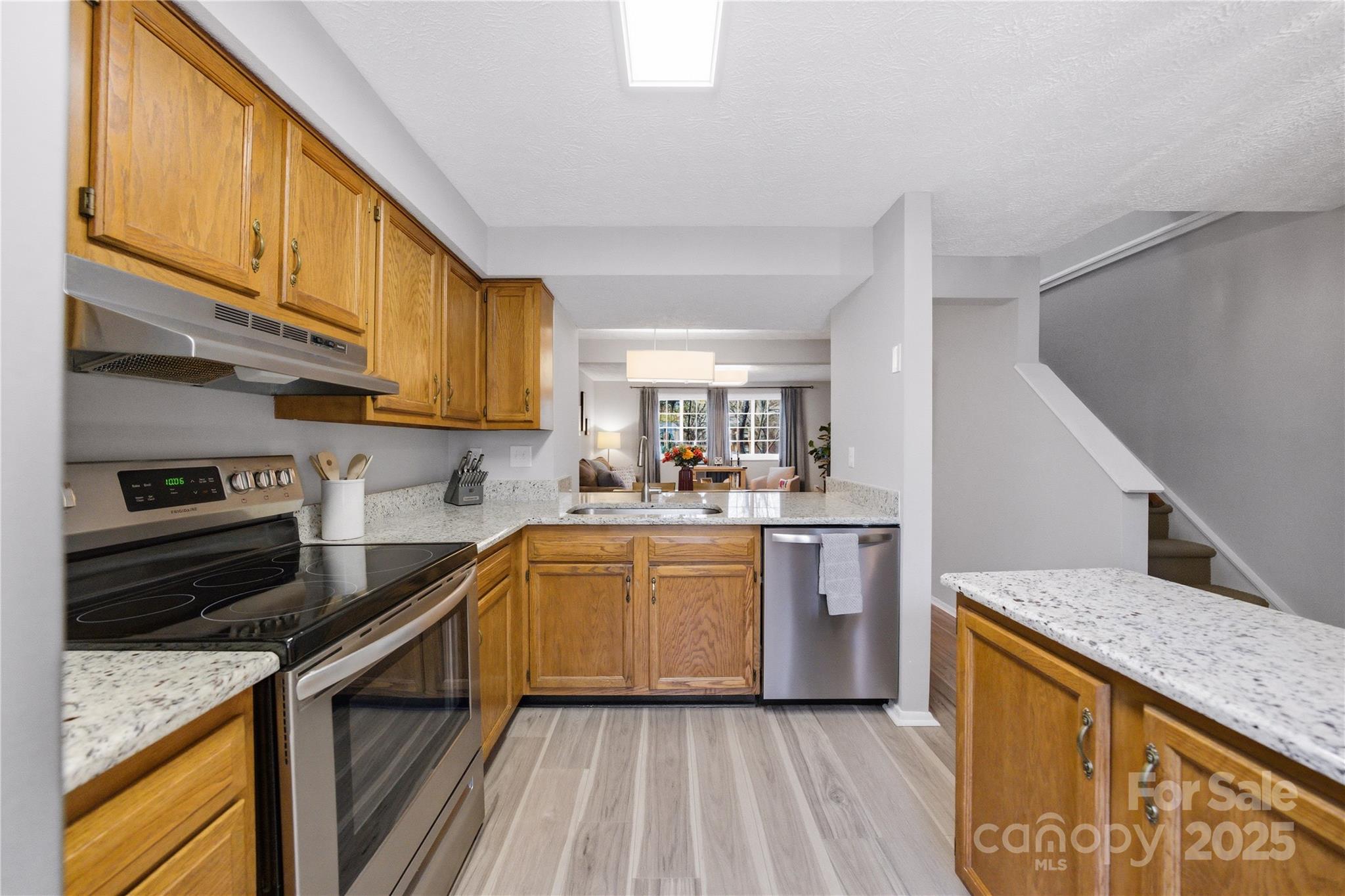 1235 Scaleybark Road, Unit C Charlotte, NC 28209 - Photo 5 of 33 a kitchen with a sink stove and refrigerator