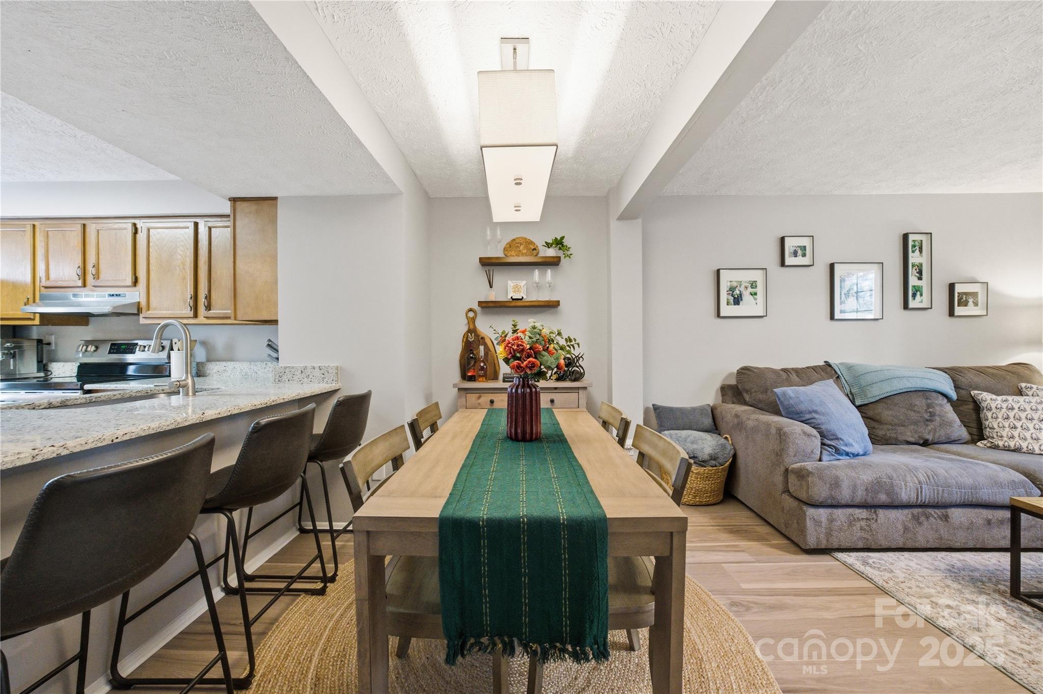 1235 Scaleybark Road, Unit C Charlotte, NC 28209 - Photo 6 of 33 a living room with furniture and a wooden floor