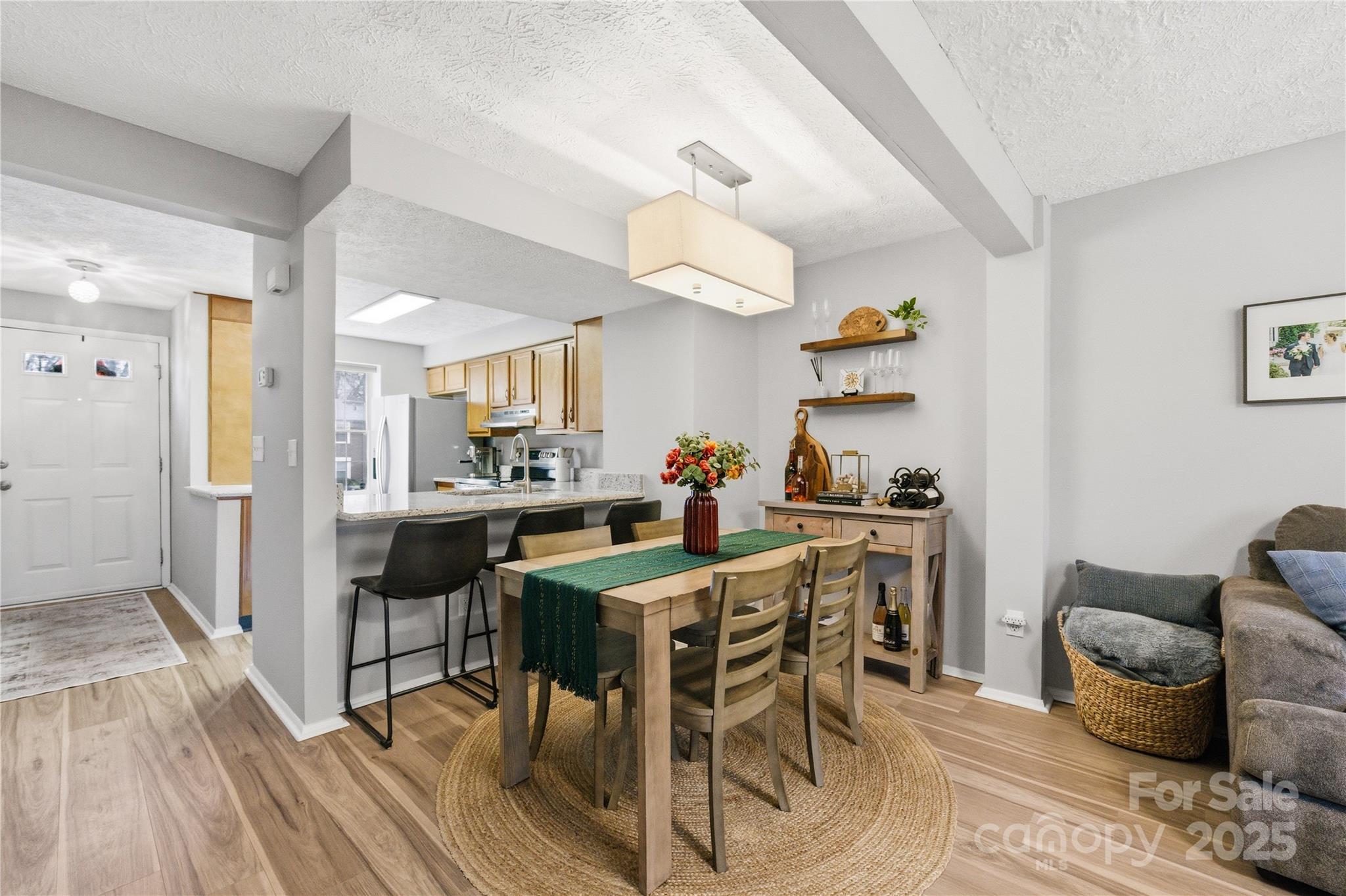 1235 Scaleybark Road, Unit C Charlotte, NC 28209 - Photo 7 of 33 a view of a dining room with furniture and wooden floor