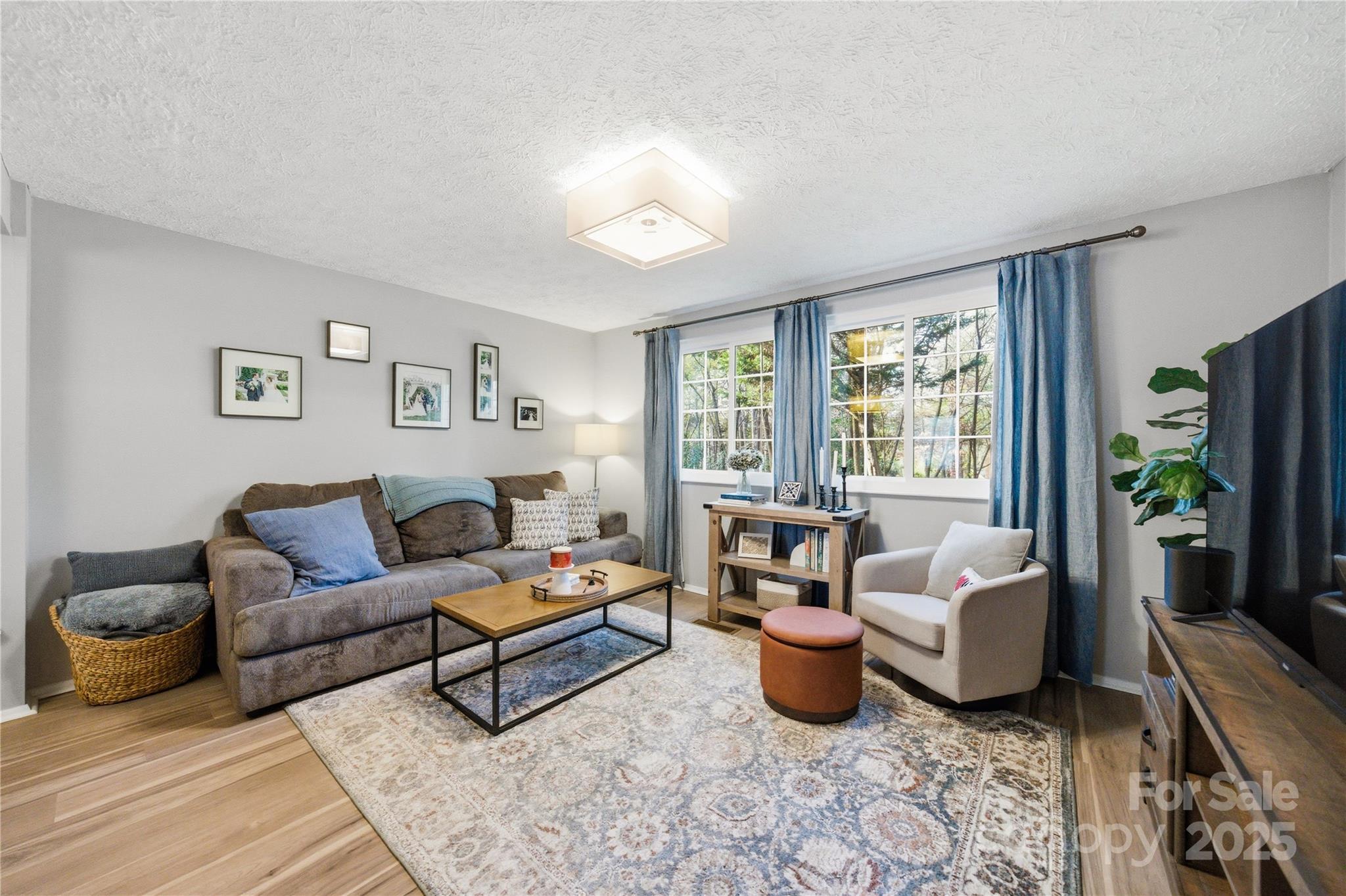 1235 Scaleybark Road, Unit C Charlotte, NC 28209 - Photo 10 of 33 a living room with furniture and a large window