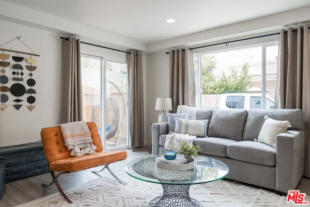 a living room with furniture and a table