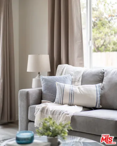 a living room with a couch and a window