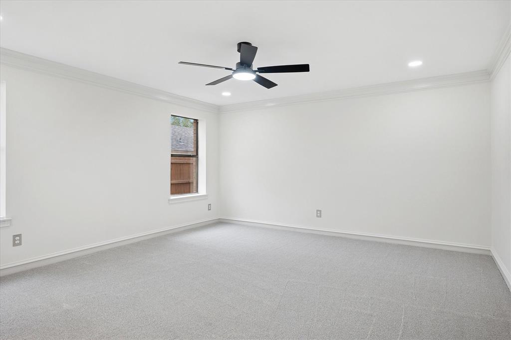 62 Legend Road Benbrook, TX 76132 - Photo 13 of 27 Spacious First Floor Primary Bedroom offers a peaceful retreat with an updated spa-inspired ensuite bath and large walk-in closet.