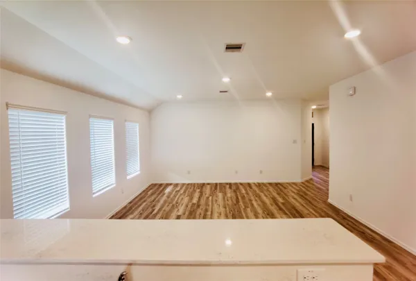 a view of wooden floor in a kitchen