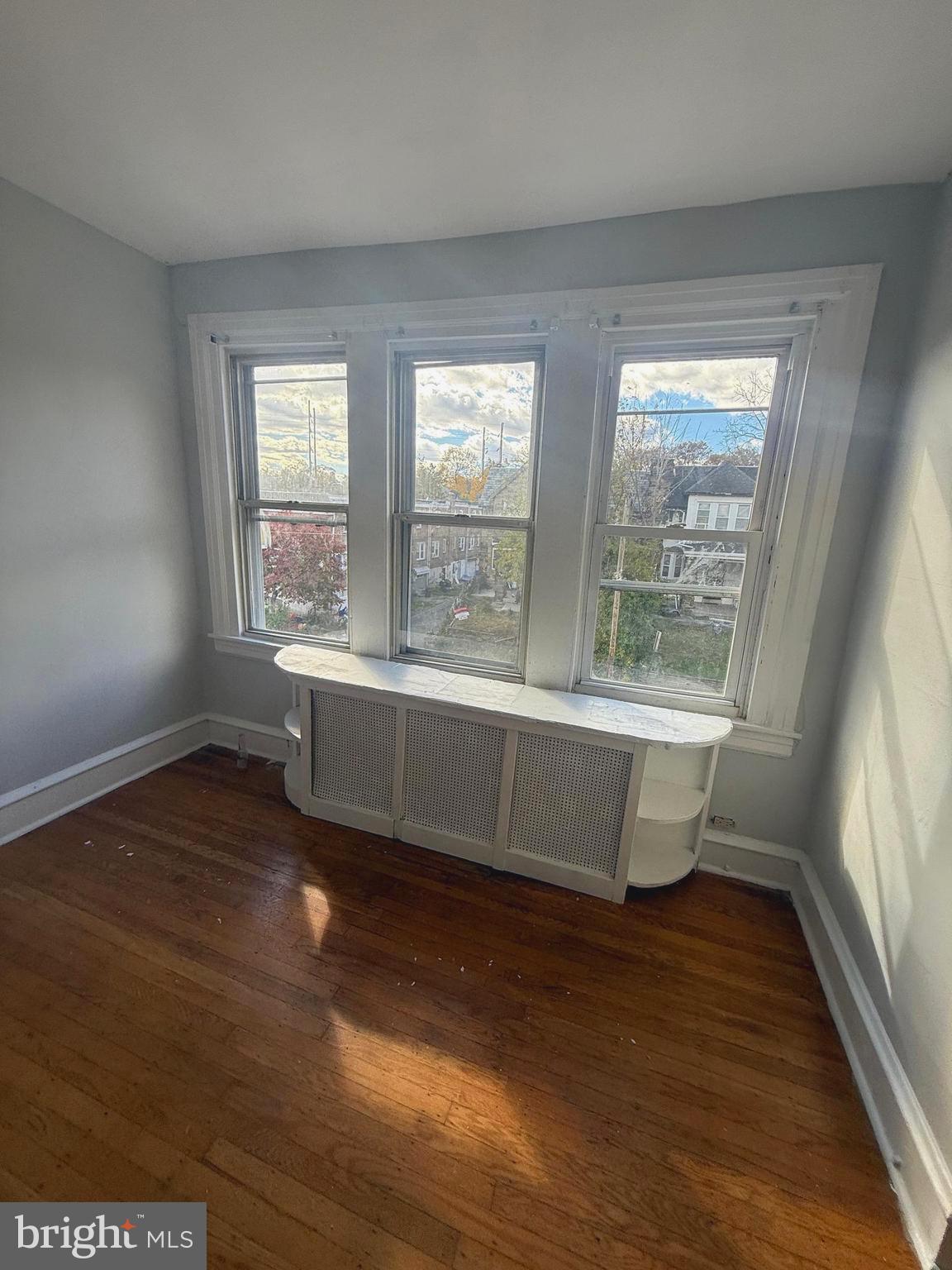 149 Springton Road Upper Darby, PA 19082 - Photo 22 of 31 a view of a room with wooden floor and a window