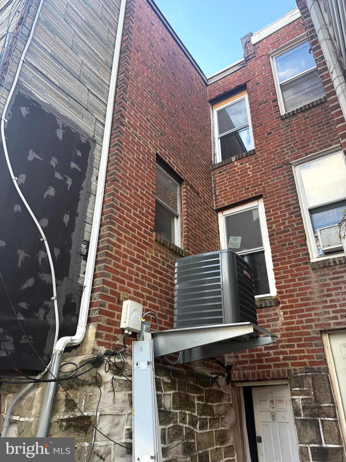 149 Springton Road Upper Darby, PA 19082 - Photo 29 of 31 a view of a brick building with many windows