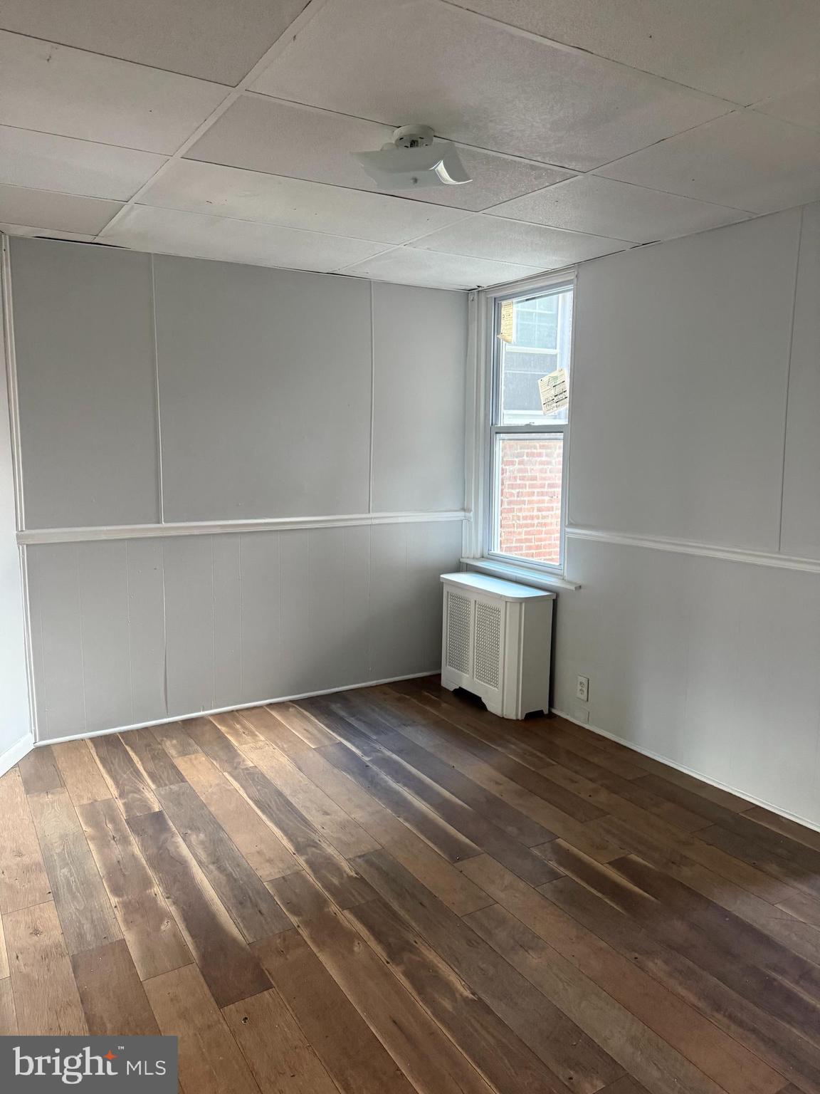 149 Springton Road Upper Darby, PA 19082 - Photo 10 of 31 a view of an empty room with a window