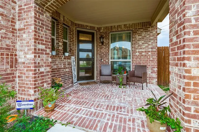 a view of a chair with a table in the patio