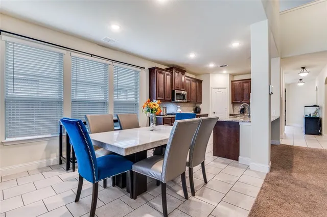 a view of a dining room with furniture