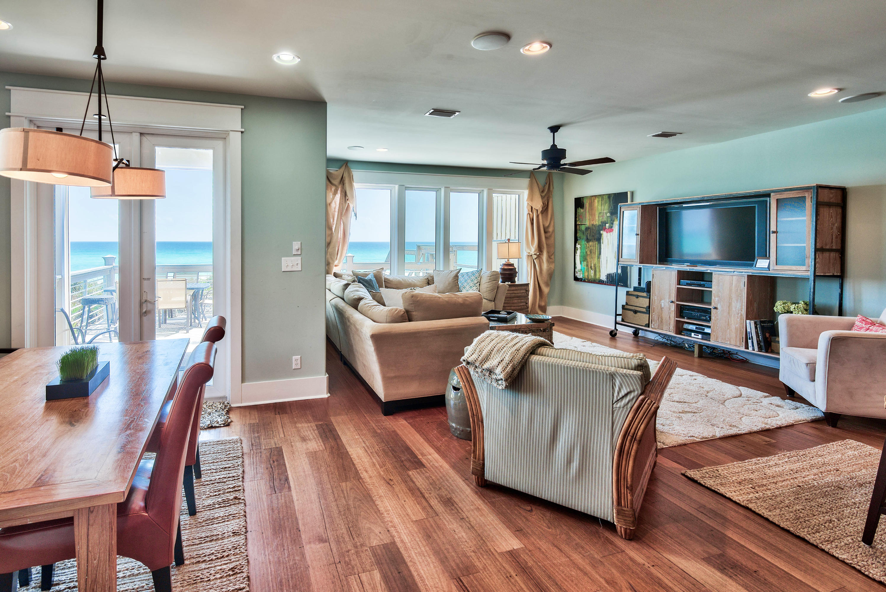 179 Pelican Circle Seacrest, FL 32461 - Photo 26 of 94 a living room with furniture a flat screen tv and a large window