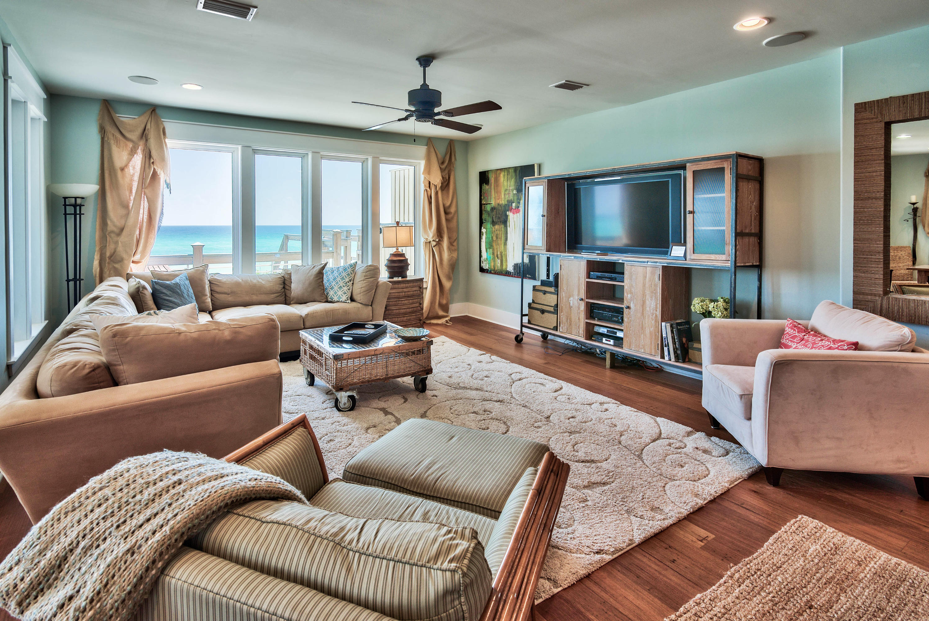 179 Pelican Circle Seacrest, FL 32461 - Photo 28 of 94 a living room with furniture and a flat screen tv