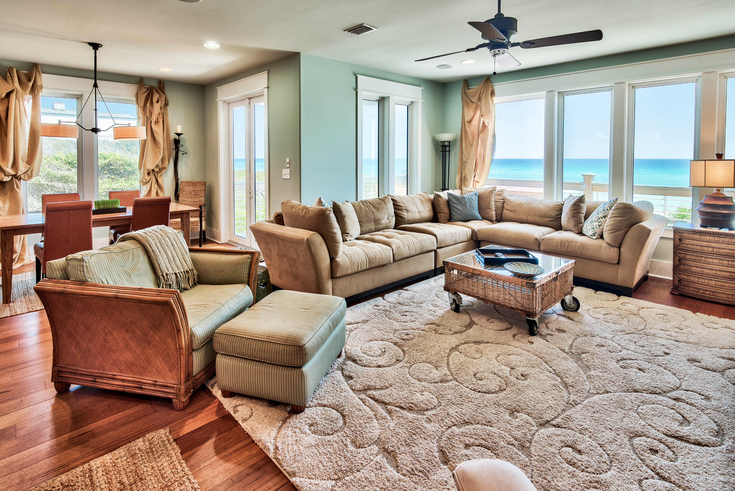 179 Pelican Circle Seacrest, FL 32461 - Photo 29 of 94 a living room with furniture wooden floor and a large window