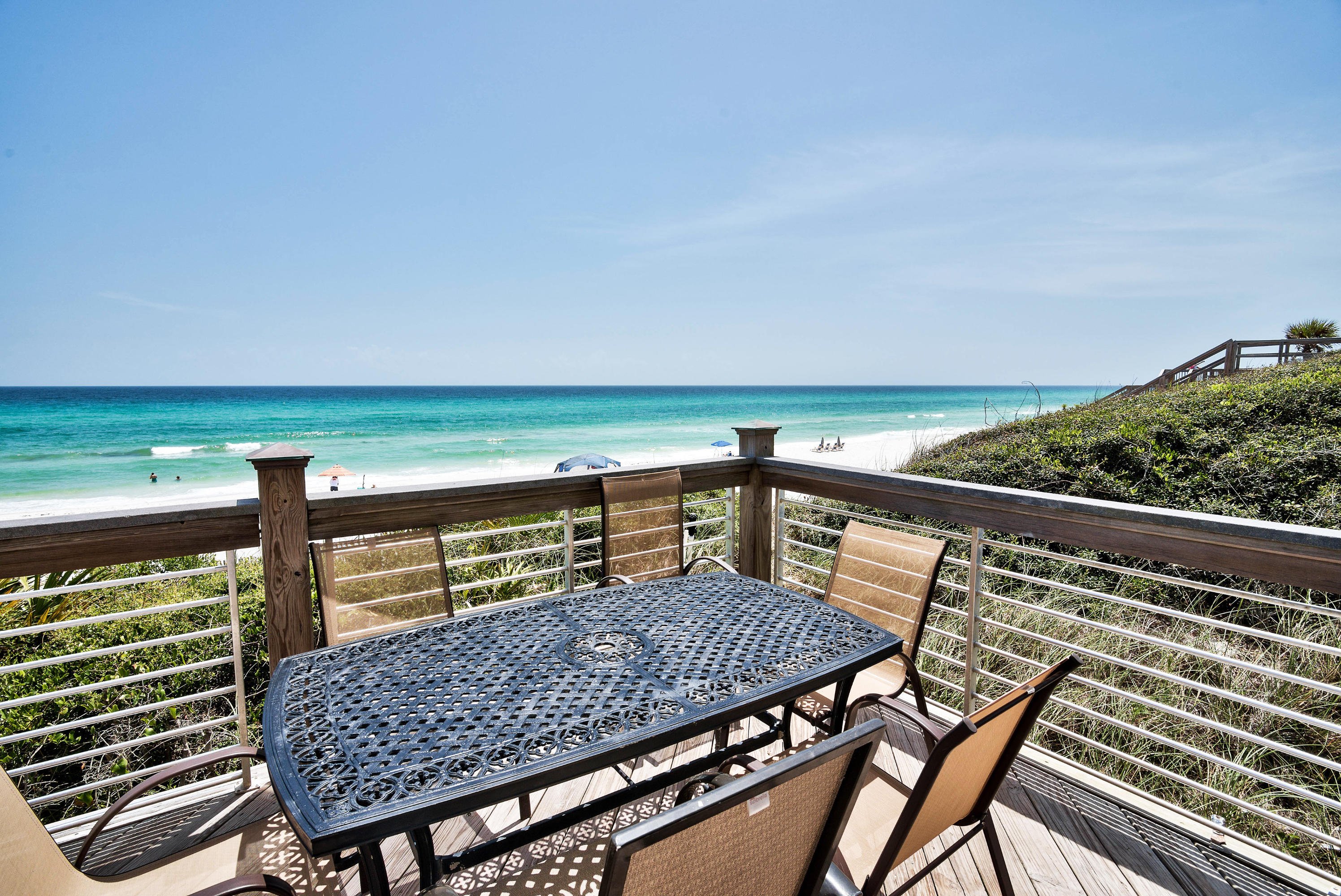 179 Pelican Circle Seacrest, FL 32461 - Photo 4 of 94 a view of a balcony with two chairs and a table