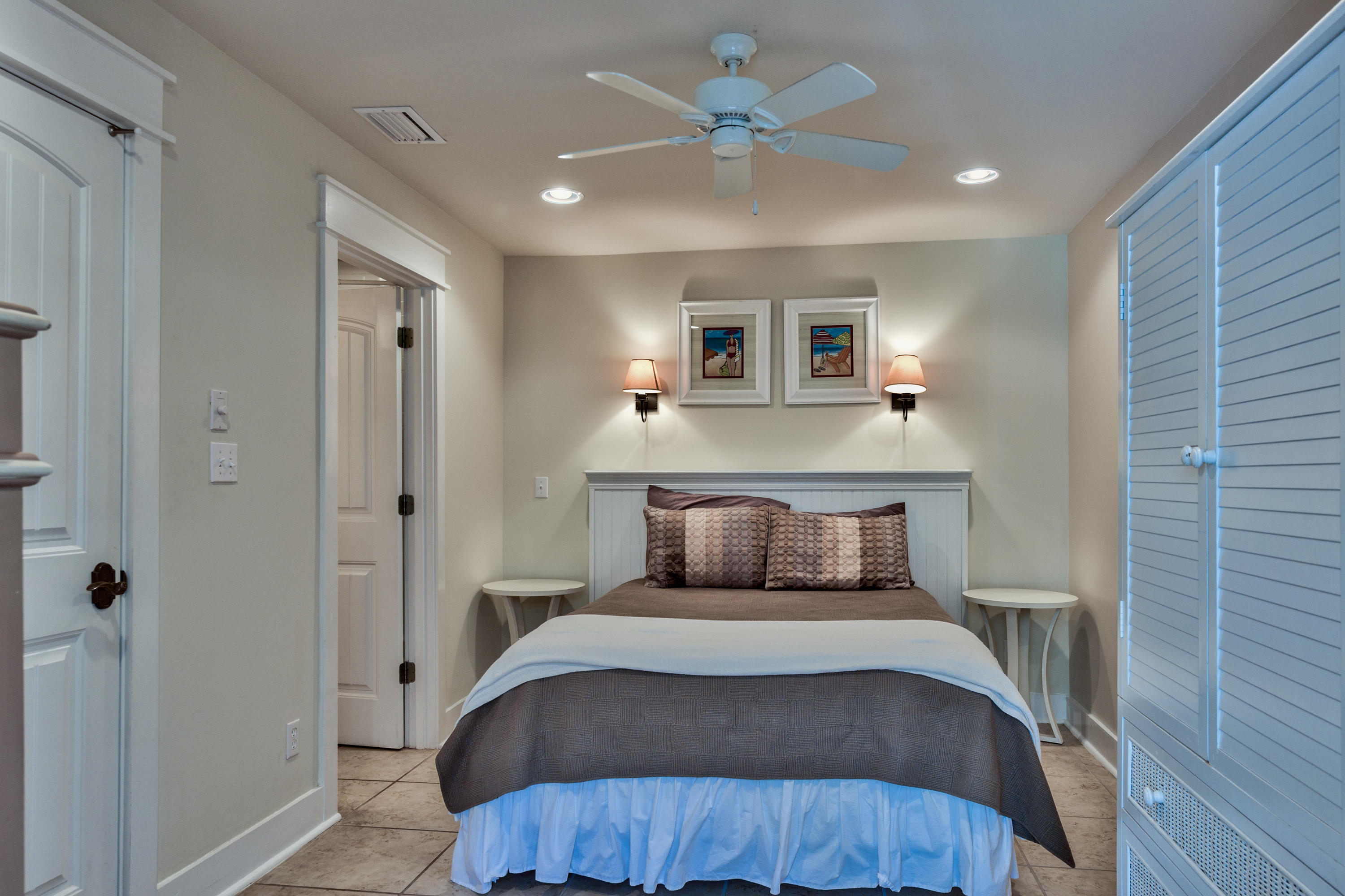 179 Pelican Circle Seacrest, FL 32461 - Photo 50 of 94 a bedroom with a bed and a chandelier