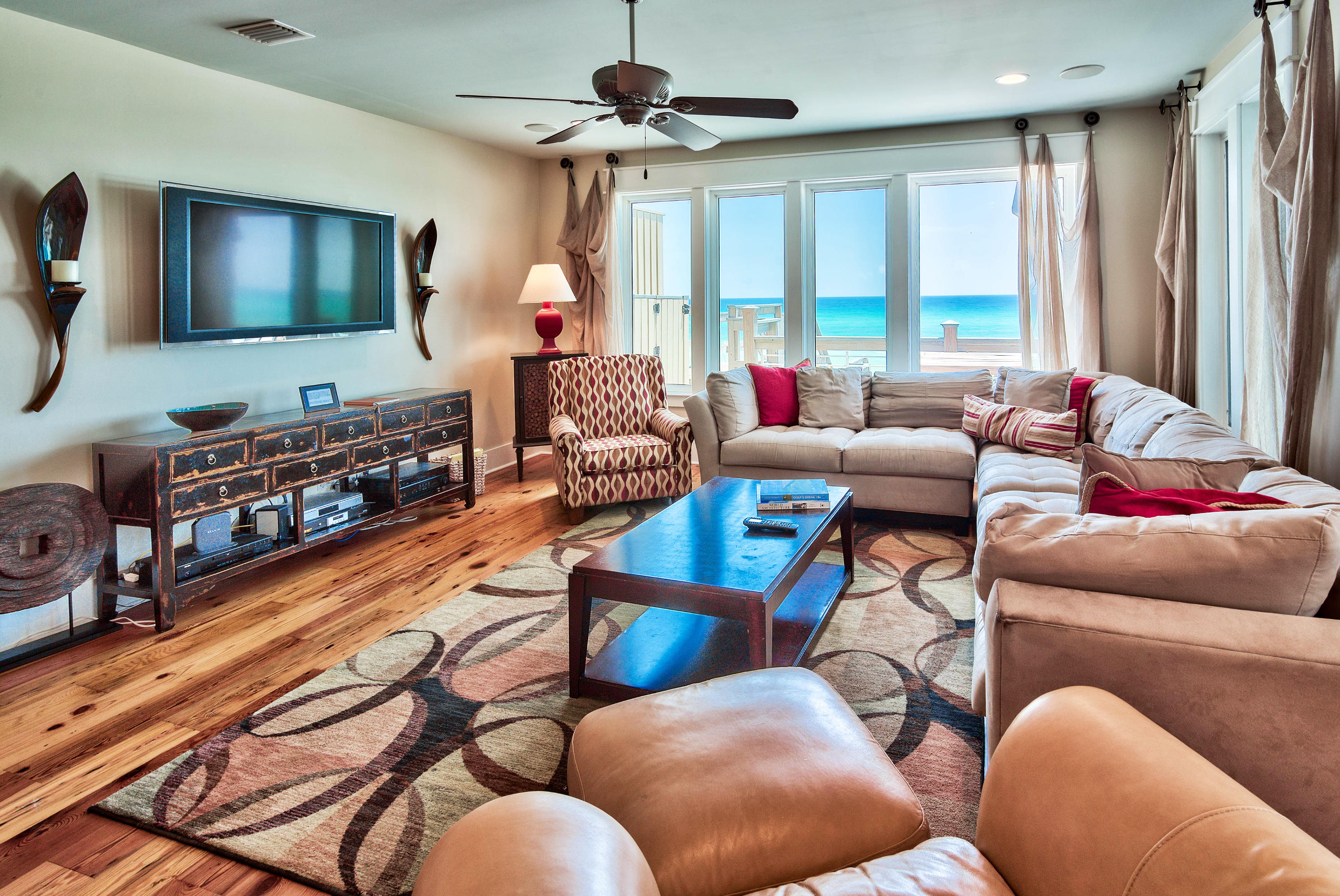 179 Pelican Circle Seacrest, FL 32461 - Photo 58 of 94 a living room with furniture and a flat screen tv