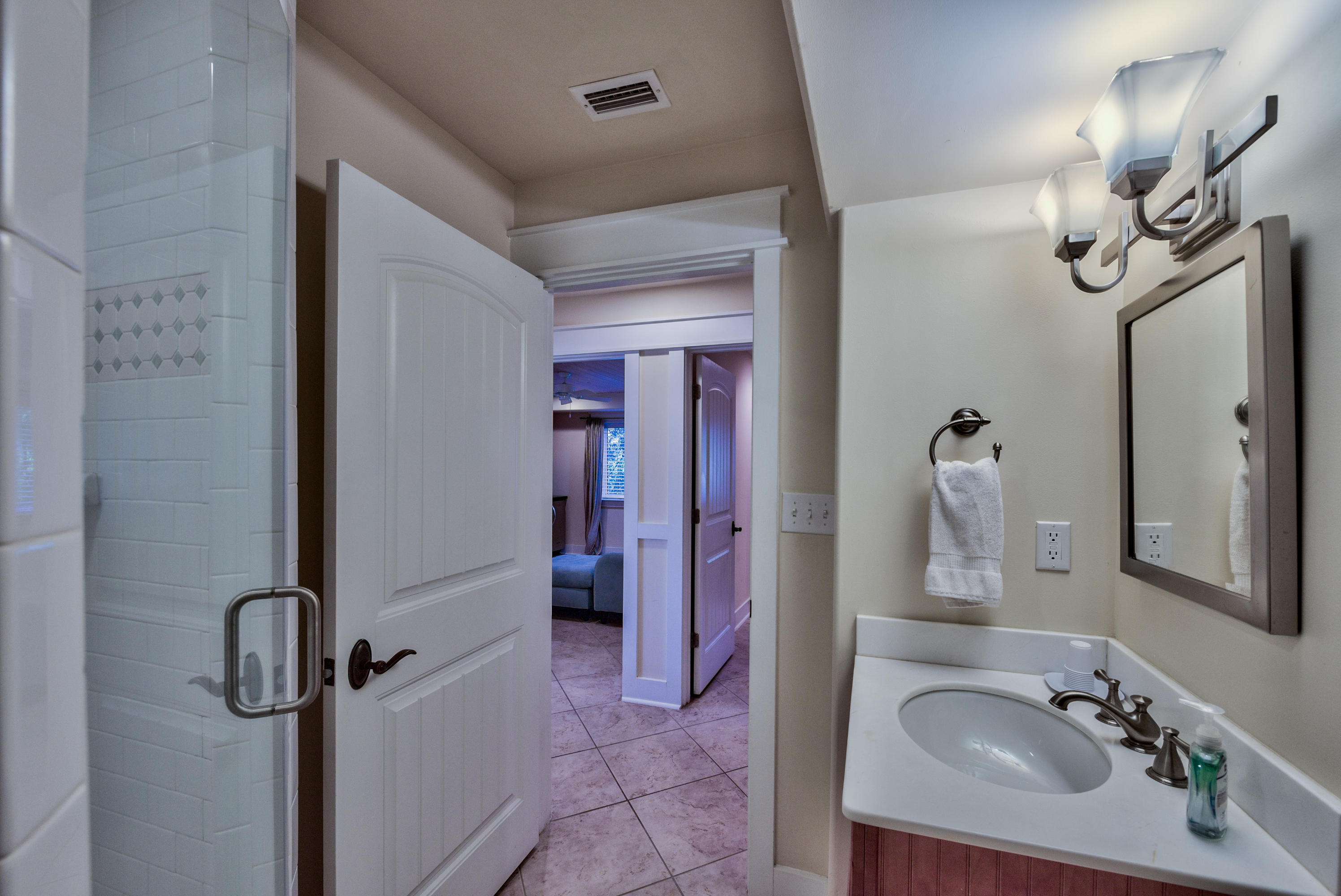 179 Pelican Circle Seacrest, FL 32461 - Photo 78 of 94 a bathroom with a sink a mirror and shower view