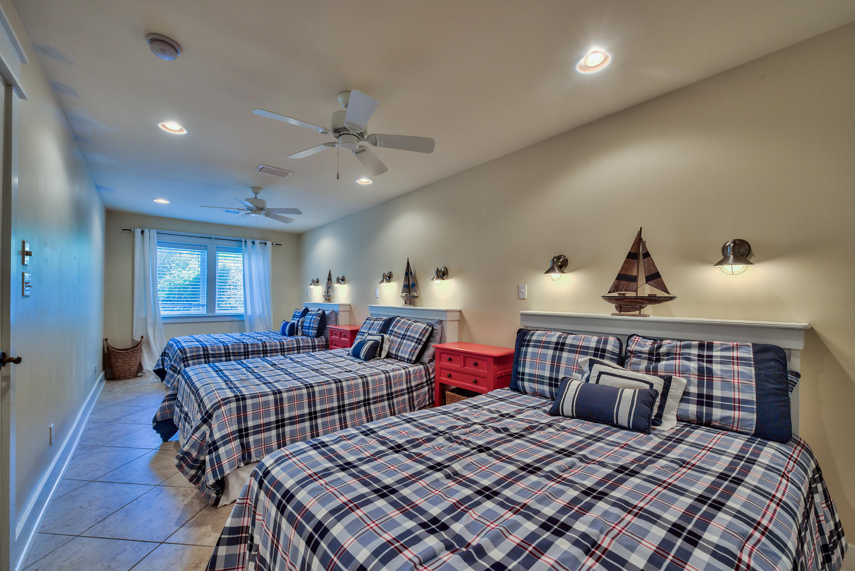 179 Pelican Circle Seacrest, FL 32461 - Photo 79 of 94 a bedroom with a large bed and a chandelier