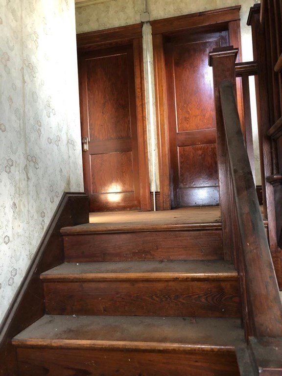 113 Perry Avenue Worcester, MA 01610 - Photo 6 of 16 a view of staircase with a rug