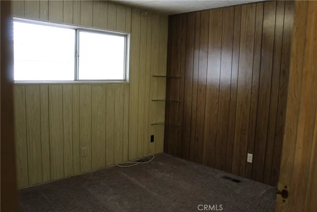 a bathroom with a shower curtain and a window
