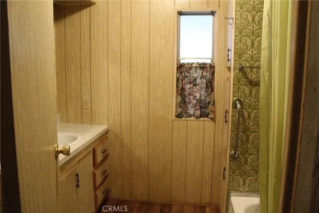 a bathroom with a granite countertop window and a sink