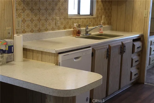 a kitchen with cabinets and a stove