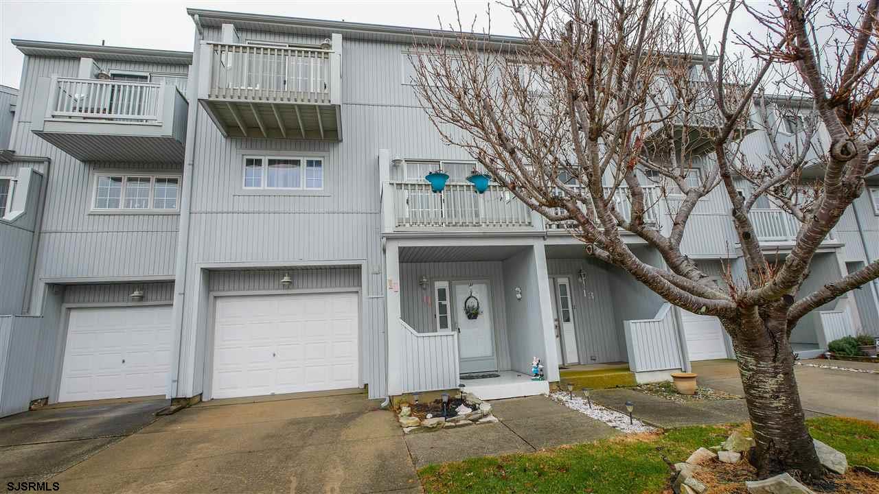 11 Sailfish Drive Brigantine, NJ 08203 - Photo 1 of 23 a front view of a house with garage