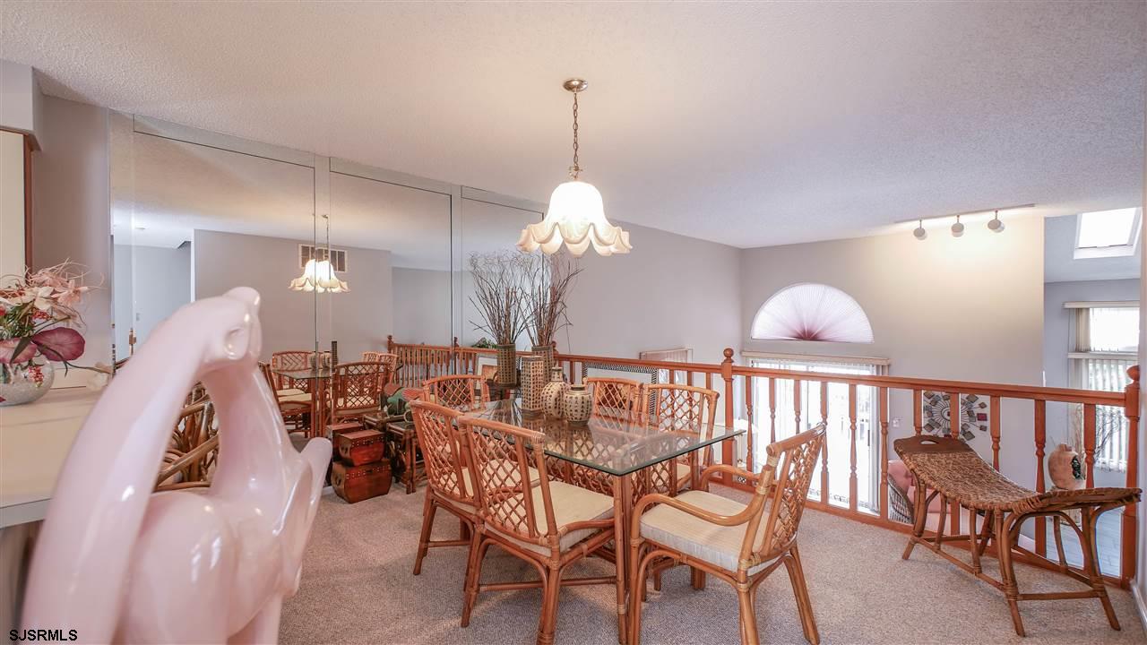 11 Sailfish Drive Brigantine, NJ 08203 - Photo 12 of 23 a view of a dining room with furniture and wooden floor