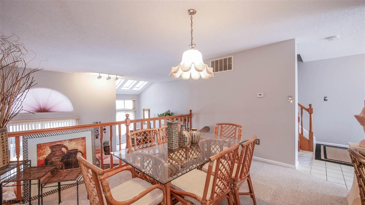 11 Sailfish Drive Brigantine, NJ 08203 - Photo 13 of 23 a view of a dining room with furniture and chandelier