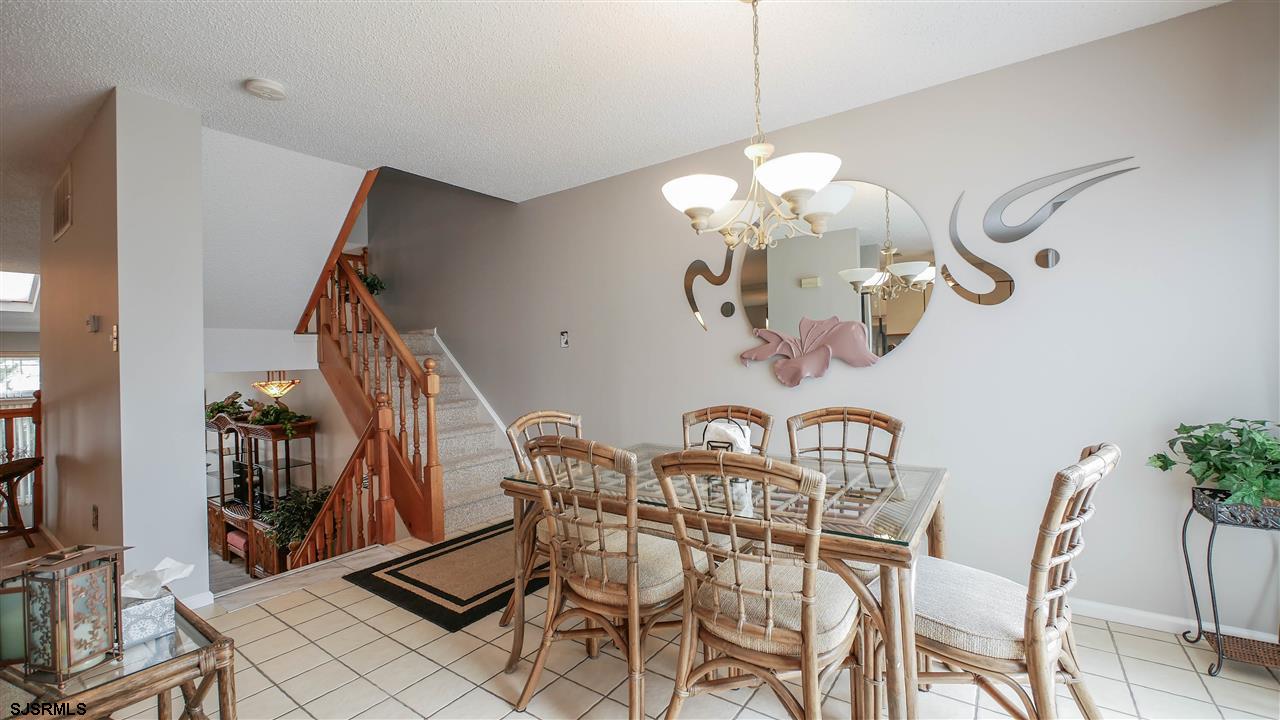 11 Sailfish Drive Brigantine, NJ 08203 - Photo 8 of 23 a view of a dining room with furniture and chandelier