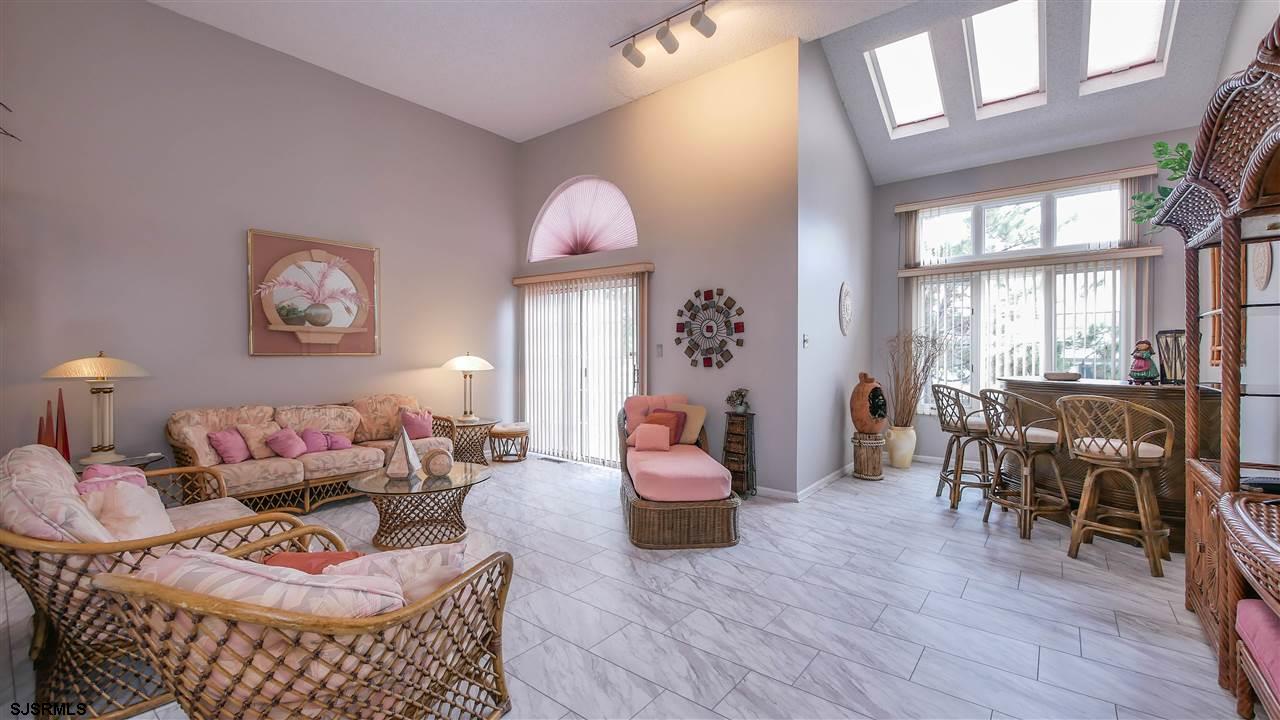 11 Sailfish Drive Brigantine, NJ 08203 - Photo 9 of 23 a living room with furniture and wooden floor