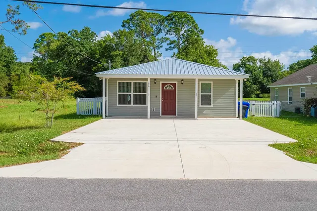 front view of a house with a yard
