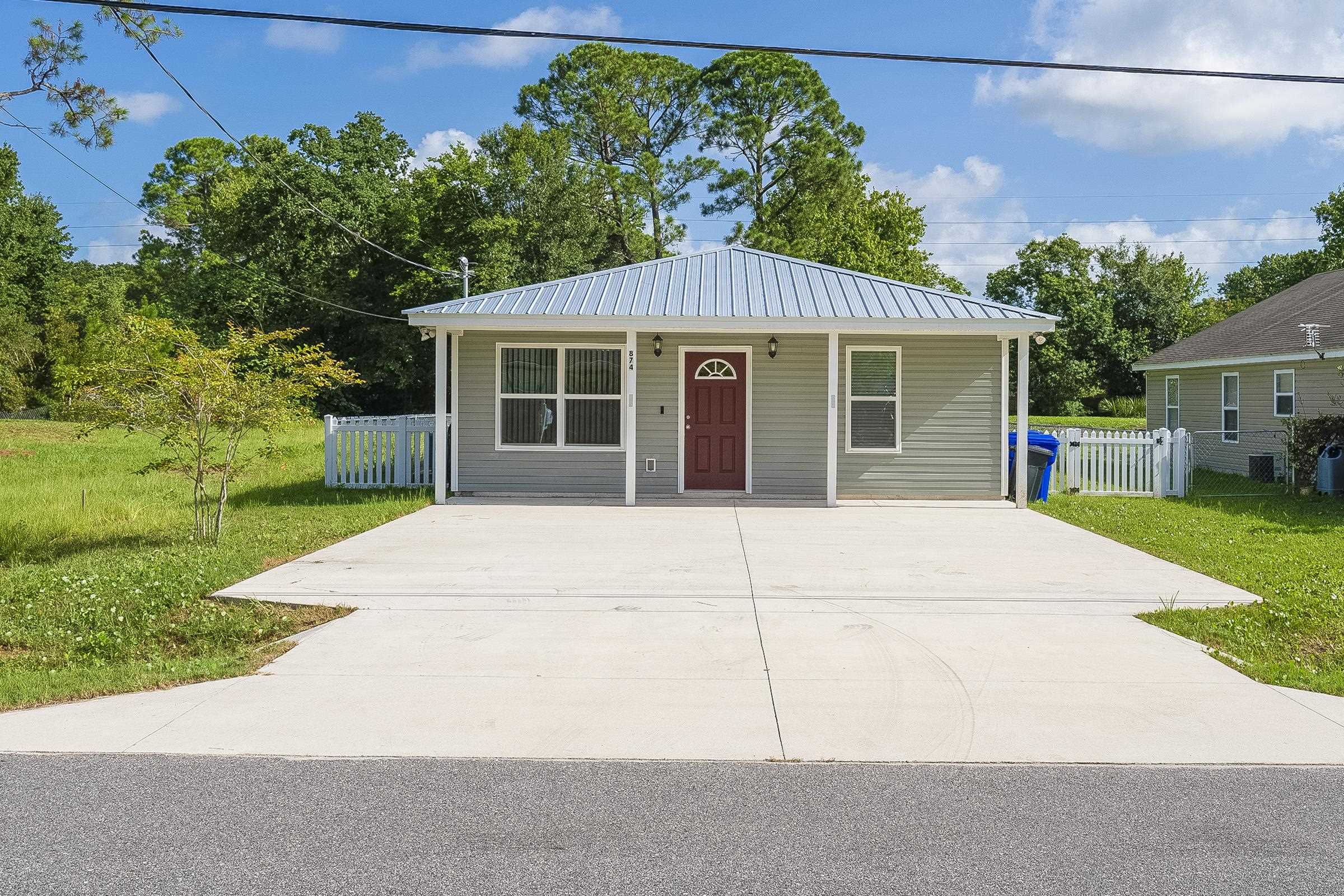 front view of a house with a yard