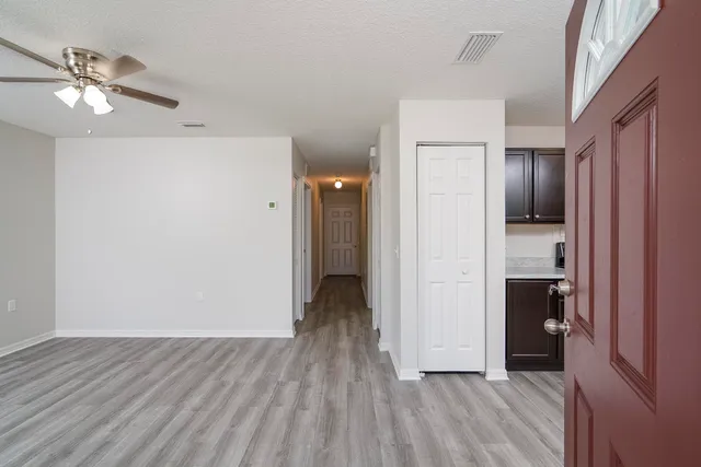 a view of a livingroom with wooden floor