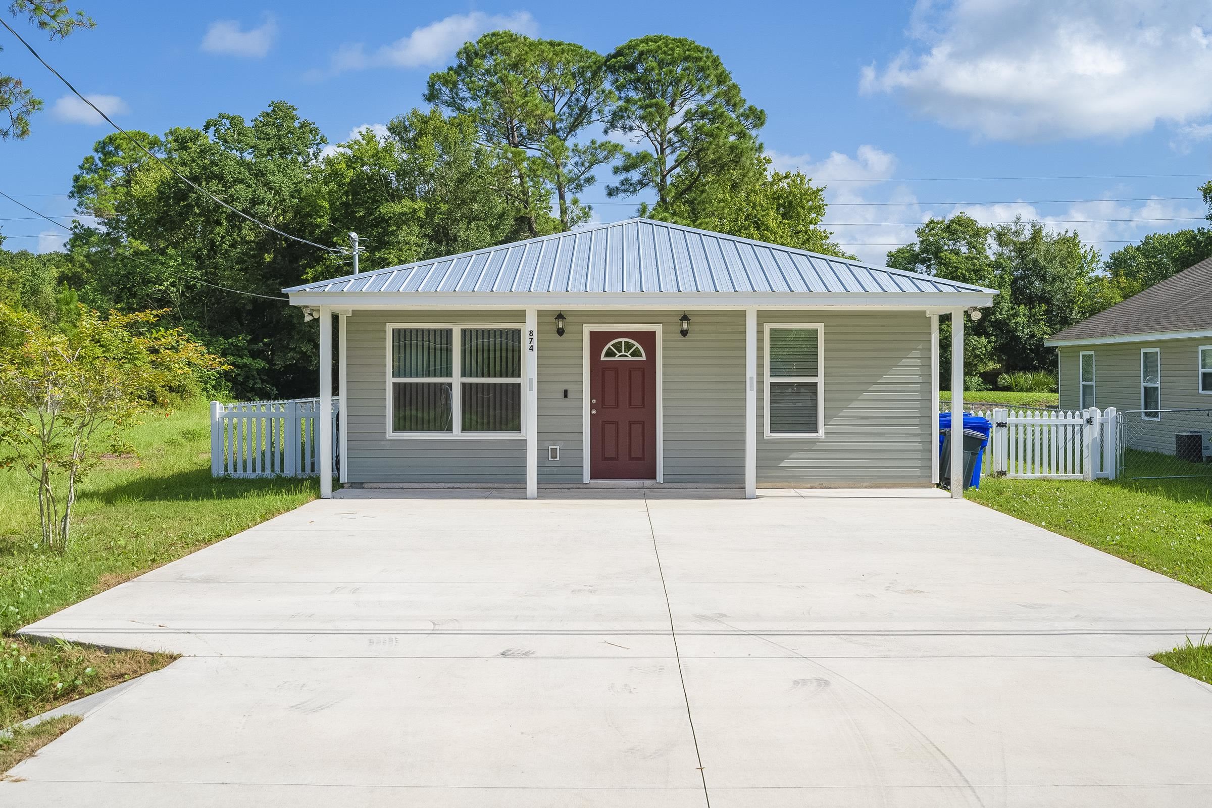 874 Ervin Street St. Augustine, FL 32084 - Photo 2 of 29 a house with a yard