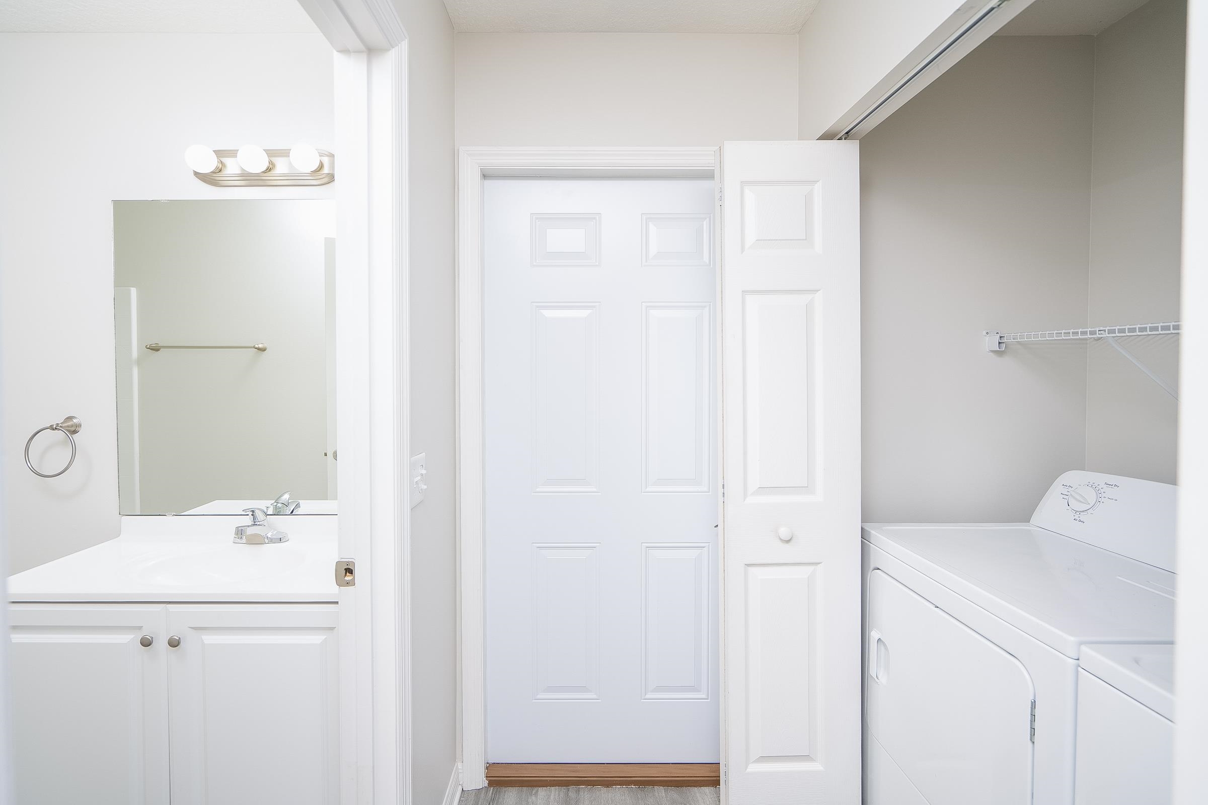 874 Ervin Street St. Augustine, FL 32084 - Photo 25 of 29 a bathroom with a sink a toilet and a mirror