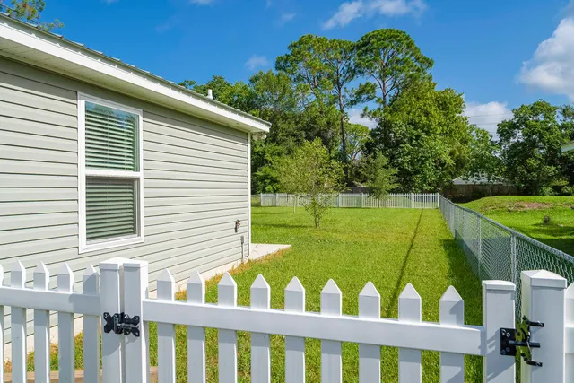 a view of a two chairs on the deck